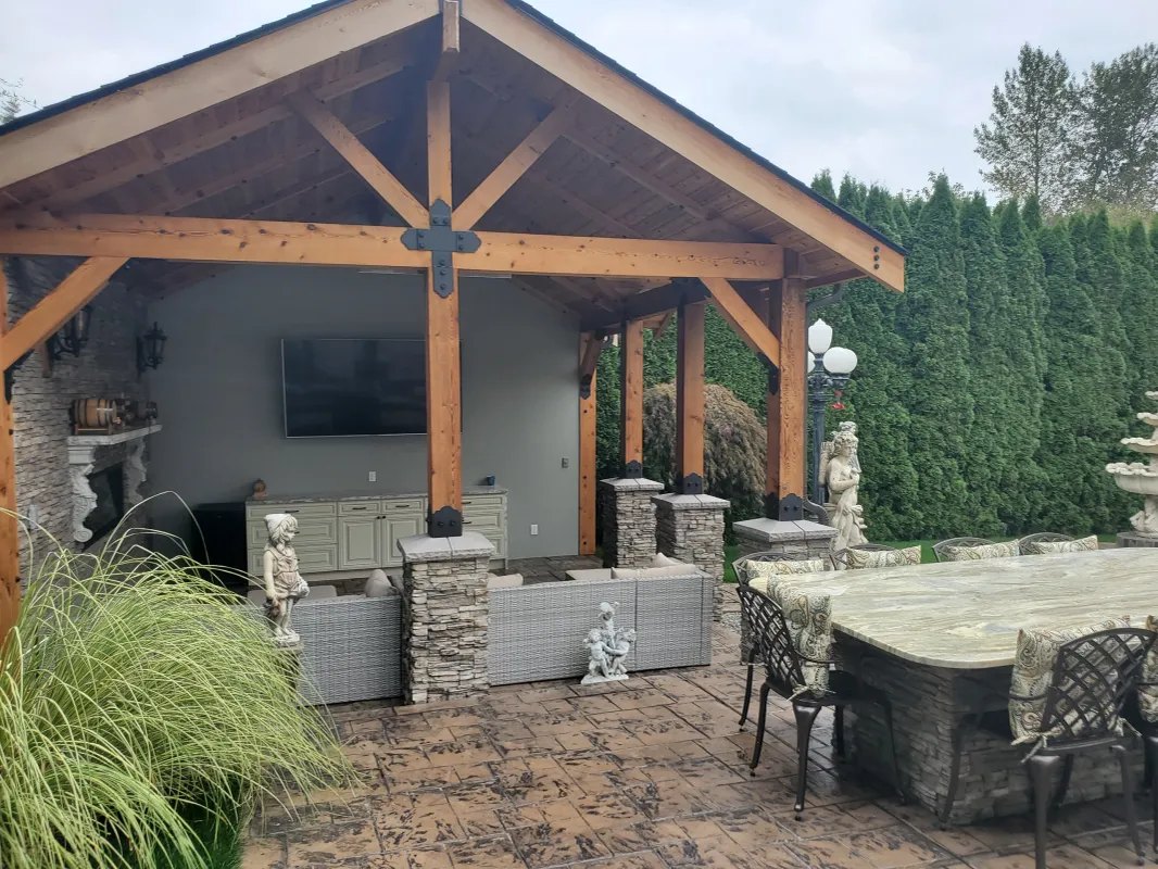 Shaded outdoor seating area with a TV under the pavilion